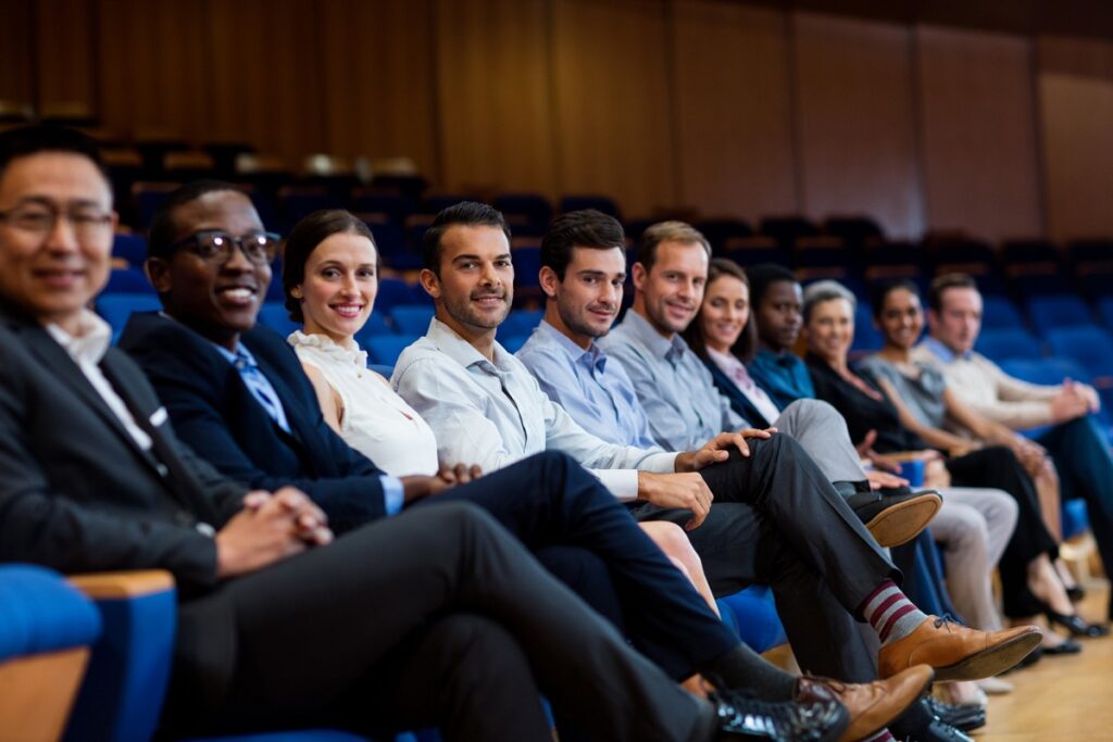 Representatives of a neighborhood community attending an event in professional attire.