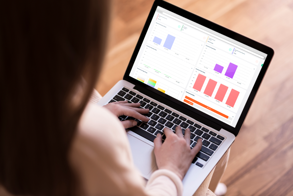 A non profit organization manager, looking at stats presented by alignography on a laptop.